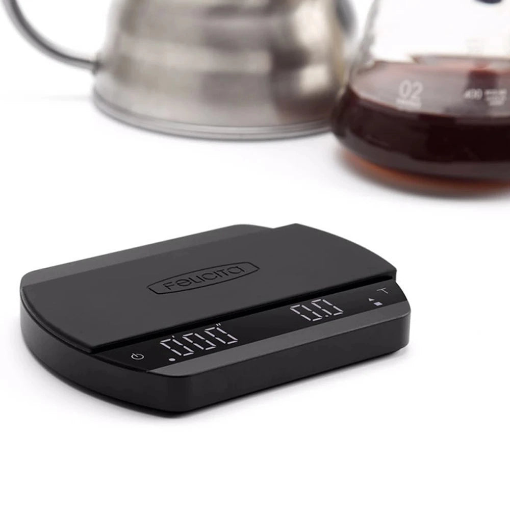 Felicita Arc Bluetooth coffee scale on counter with kettle and carafe in background