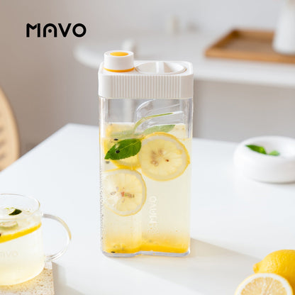 MAVO Crysbrick Cold Brewer in white used for lemon iced tea alongside a glass mug