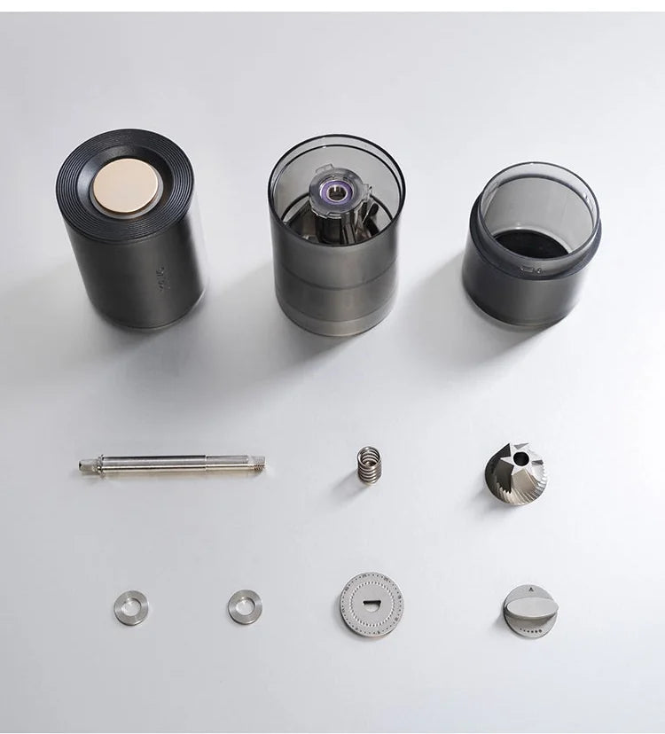 MAVO Aurora disassembled parts: motor unit, grinder body, grounds bin, shaft, spring, burrs and adjustment parts