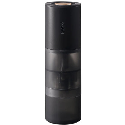 MAVO Aurora portable electric coffee grinder in black, semi-transparent grinding chamber and grounds bin, front view on white