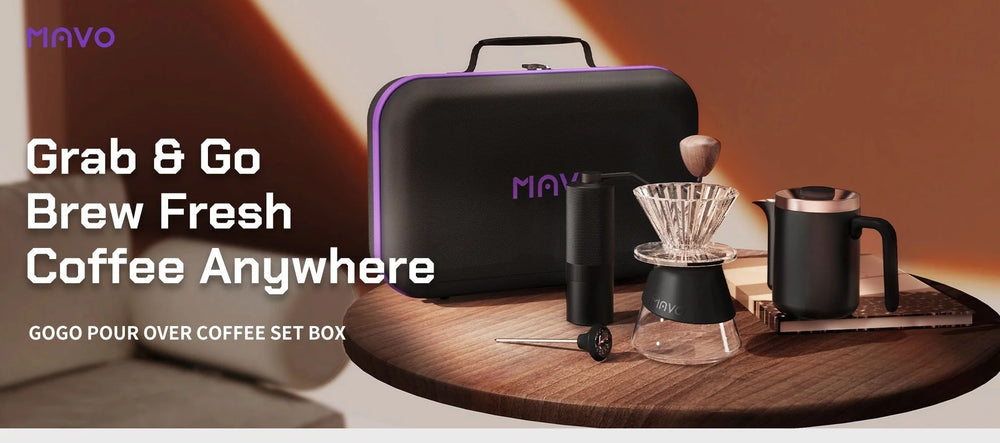 Grab and go, brew fresh coffee anywhere: the MAVO GOGO pour over coffee set box with grinder, clear dripper, carafe and kettle on a wooden table