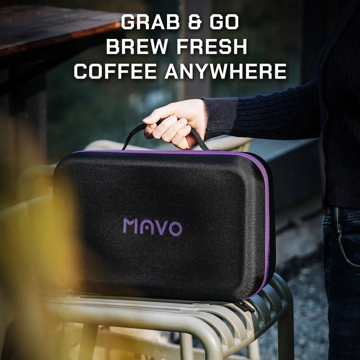 Carrying the MAVO GOGOBOX case by its handle outdoors: grab and go, brew fresh coffee anywhere