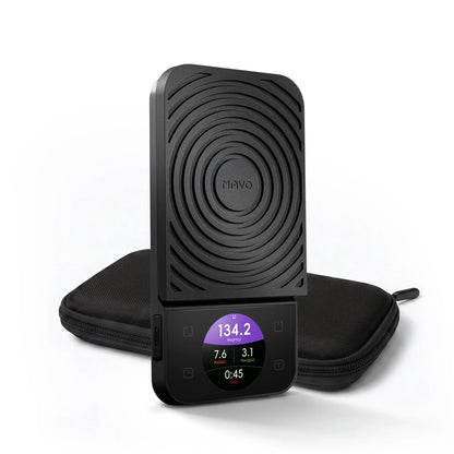 MAVO Lumicurve Coffee Scale in black, standing upright in front of its zip carrying case, colour screen showing weight, ratio, flow rate and time