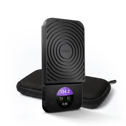 MAVO Lumicurve Coffee Scale in black, standing upright in front of its zip carrying case, colour screen showing weight, ratio, flow rate and time