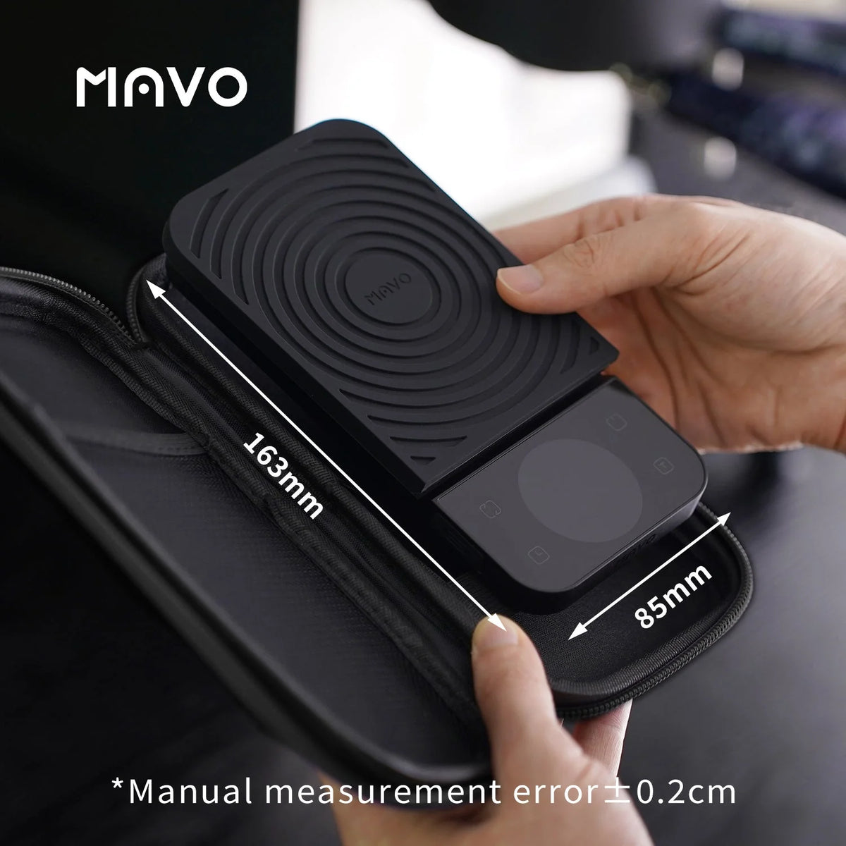 MAVO Lumicurve scale being placed into its zip carrying case, with hand-measured length and width marked