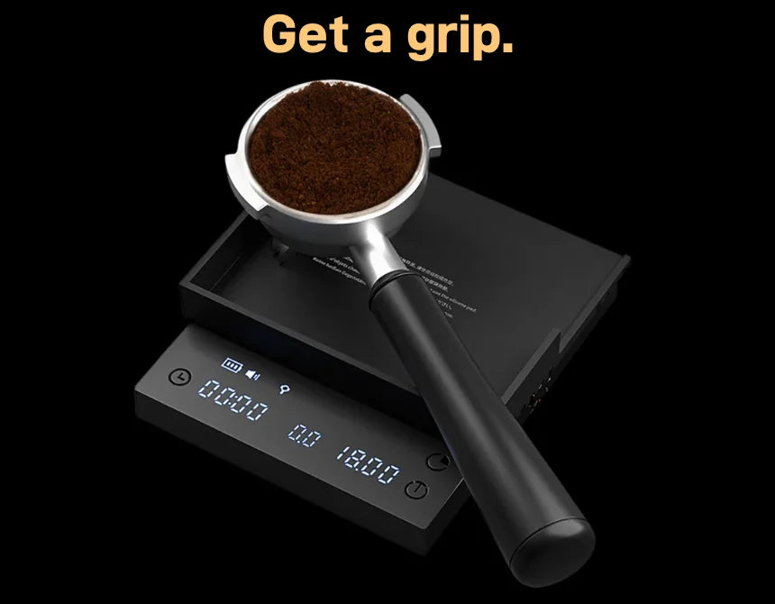 'Get a grip.' (slide 3 of 3) The Basic 3 mat flipped over as a contoured portafilter rest, holding a portafilter of ground coffee while the display reads the dose