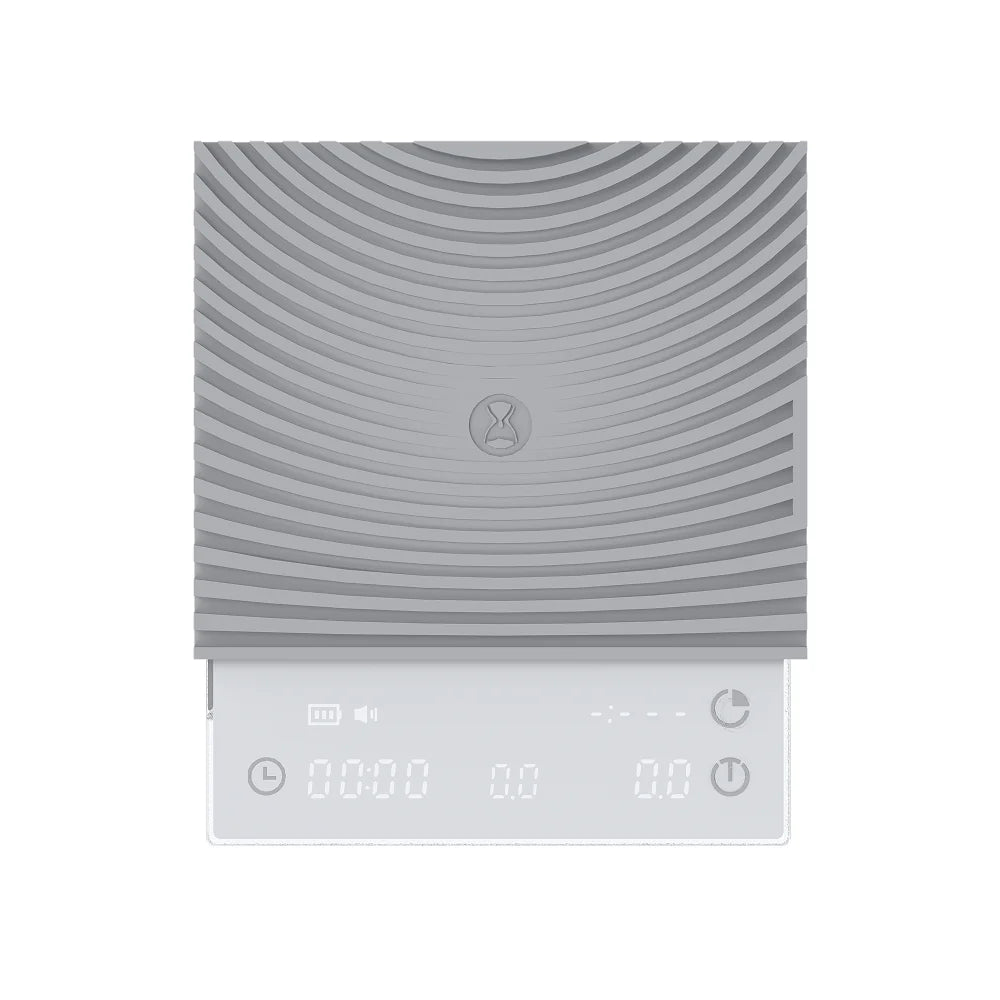 Front view of the white TIMEMORE Basic 3 with its ribbed silicone mat fitted and the display showing timer, weight and flow rate