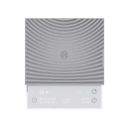Front view of the white TIMEMORE Basic 3 with its ribbed silicone mat fitted and the display showing timer, weight and flow rate