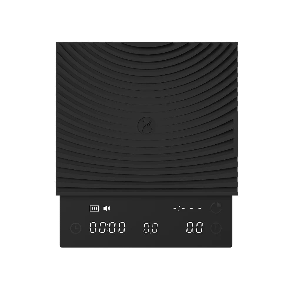 Front view of the black TIMEMORE Basic 3 scale, ribbed silicone mat on top and the hidden LED display showing timer 00:00, weight 0.0 and flow rate 0.0
