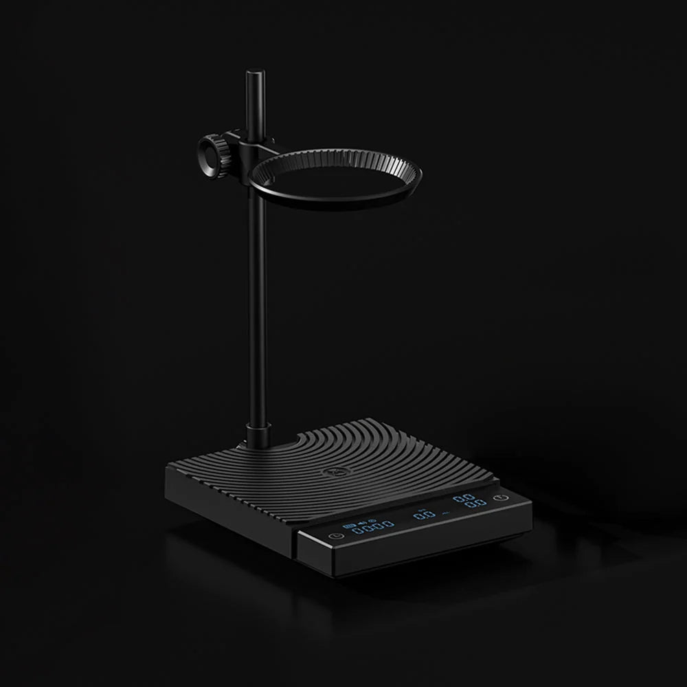 The DUO with its swivel dripper ring and post against a black background