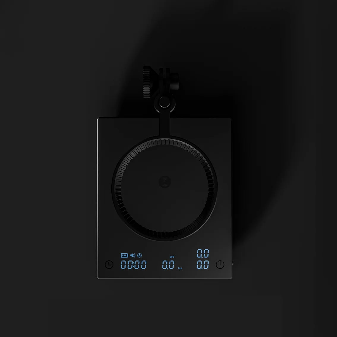 Top view of the DUO with the dripper ring swung over the scale and the display glowing at the front