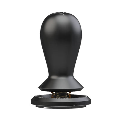 Black TIMEMORE × Anthony Douglas FLOW self-leveling tamper standing upright on a white background, with a black teardrop handle, tapered collar, gold wave spring and a 58.5mm black base
