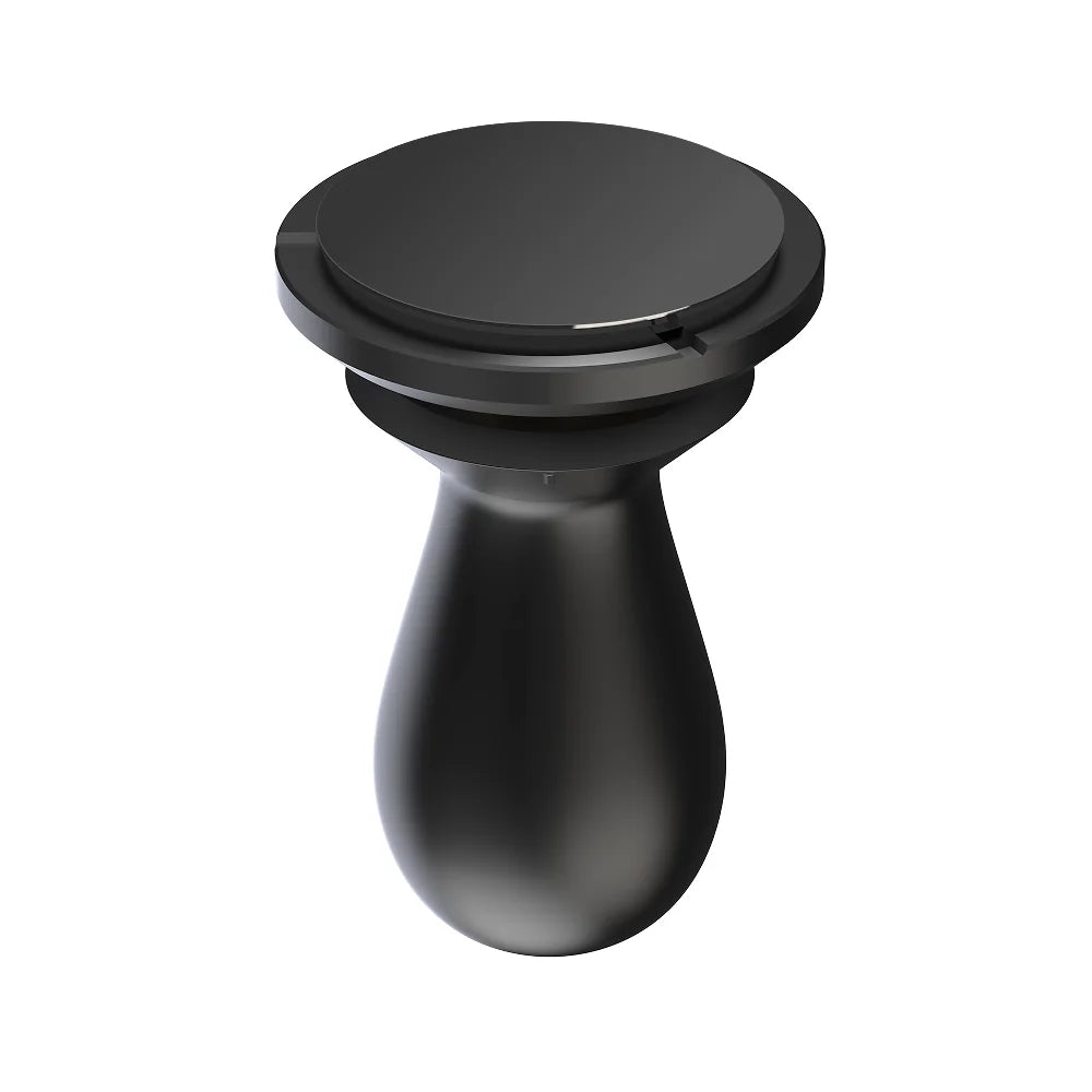 FLOW tamper tilted on a white background to show its flat black DLC-coated 58.5mm base face and rounded handle