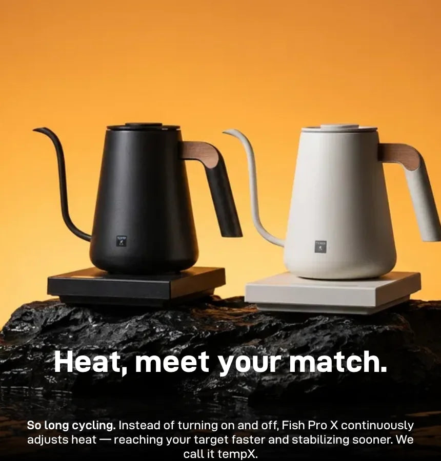 TIMEMORE Fish Pro X electric pour over kettles in Black and White on their bases atop dark rock against an amber backdrop, headline 'Heat, meet your match.' — so long cycling: instead of turning on and off, Fish Pro X continuously adjusts heat to reach the target faster and stabilise sooner, called tempX