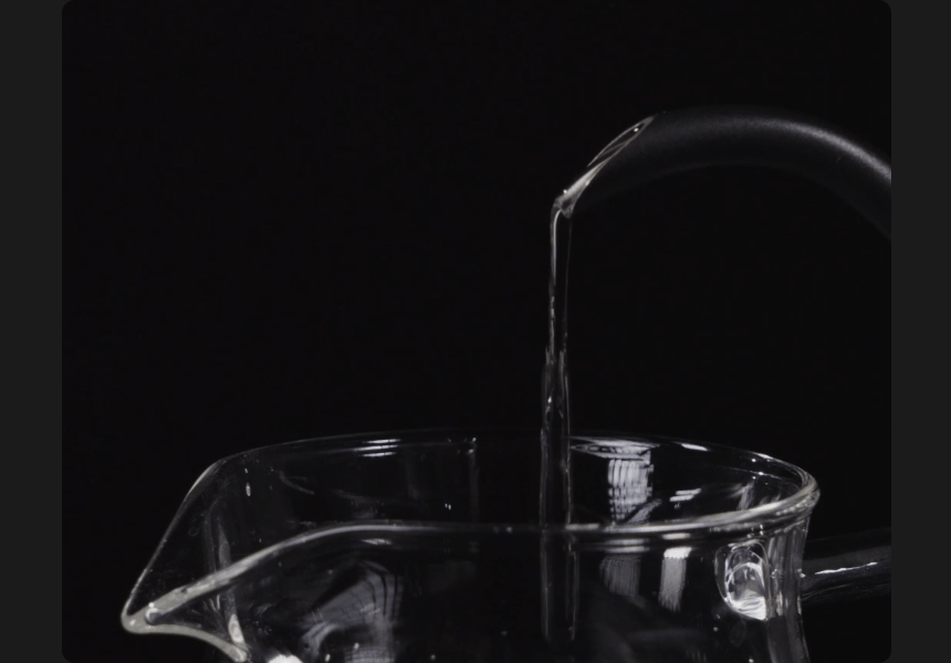 Animated: a steady medium-flow stream pouring from the Fish Pro X gooseneck spout into a glass server