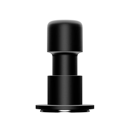 Front view of the black Impulse Impact Tamper on a white background: a rounded anodised aluminium grip over a stepped body and a flat round base