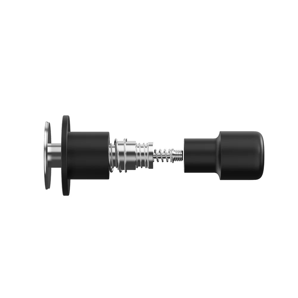 Exploded view of the black Impulse Impact Tamper showing the stainless steel base, the internal dual springs and the aluminium grip pulled apart