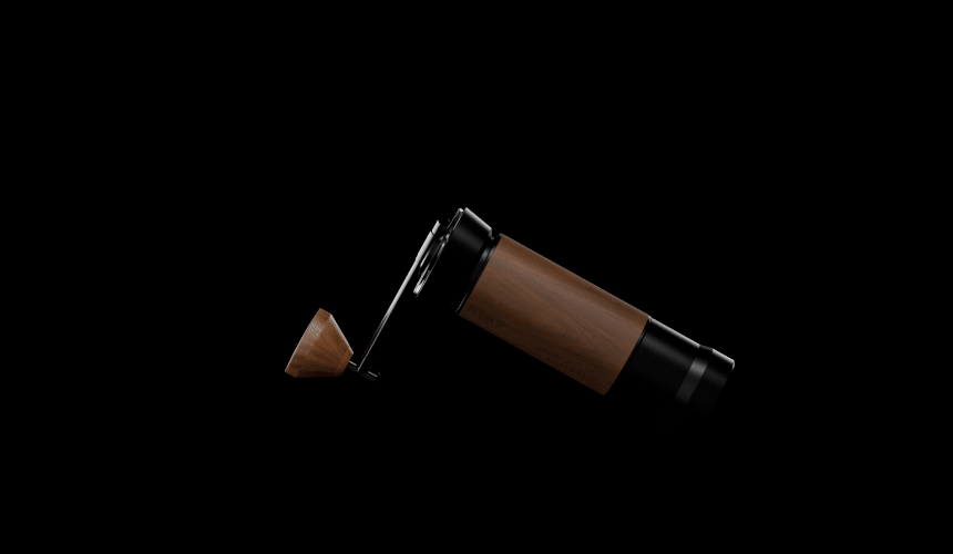 Animated black and walnut M01 hand grinder rotating in the dark with its crank and walnut knob