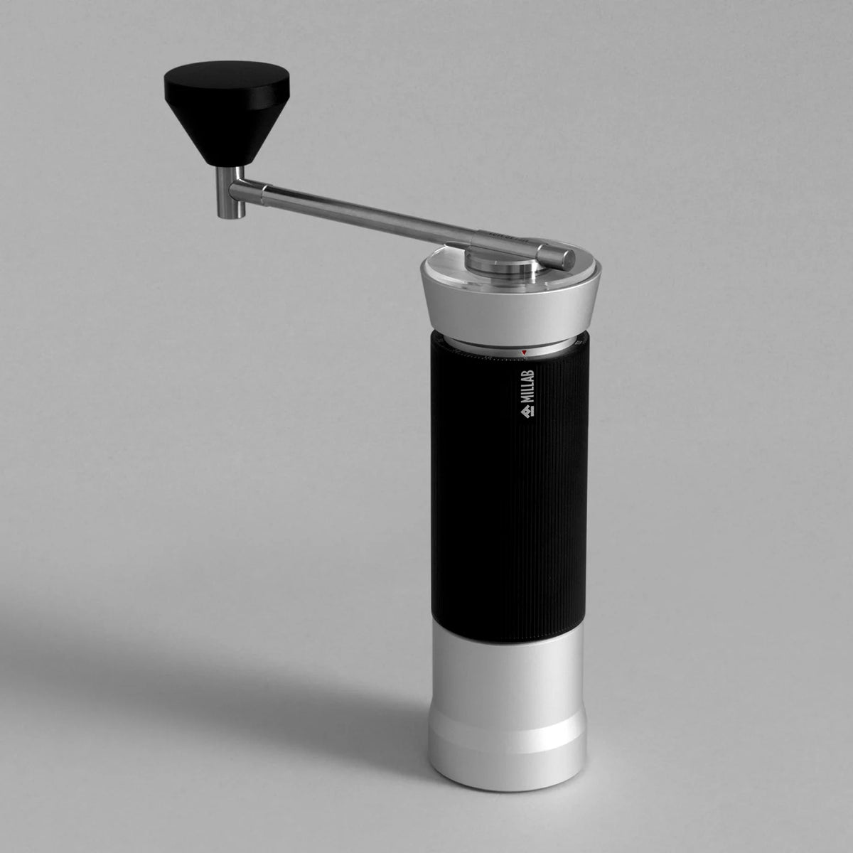 TIMEMORE x MILLAB M01 hand grinder in Silver with black grip and black knob, three-quarter view on a grey studio background