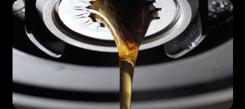 Animation of brewed coffee running from the VECTOR outlet into a server and rippling