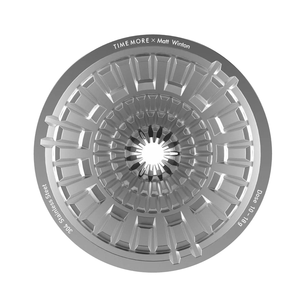 Top-down view into the VECTOR dripper: the stainless steel lattice of contact points converging on the spout, rim engraved TIMEMORE x Matt Winton and Dose 10-18g