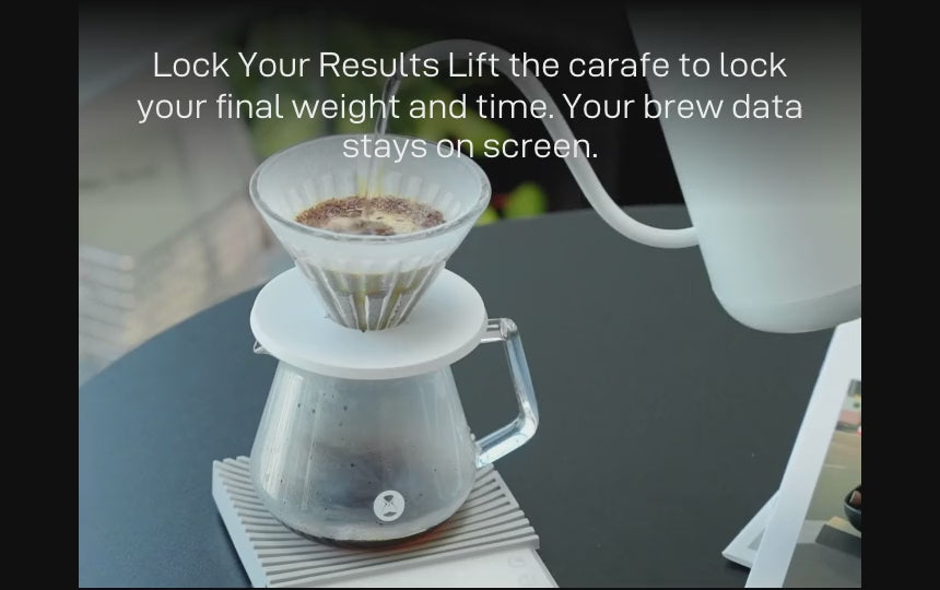 Lock Your Results: a pour-over finishing on the white Basic 3, the display holding the final weight and time — 'Lift the carafe to lock your final weight and time. Your brew data stays on screen.'