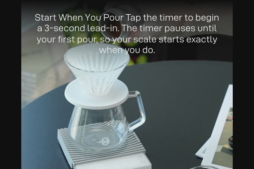 Start When You Pour: a pour-over dripper and glass server on the white Basic 3 — 'Tap the timer to begin a 3-second lead-in. The timer pauses until your first pour, so your scale starts exactly when you do.'